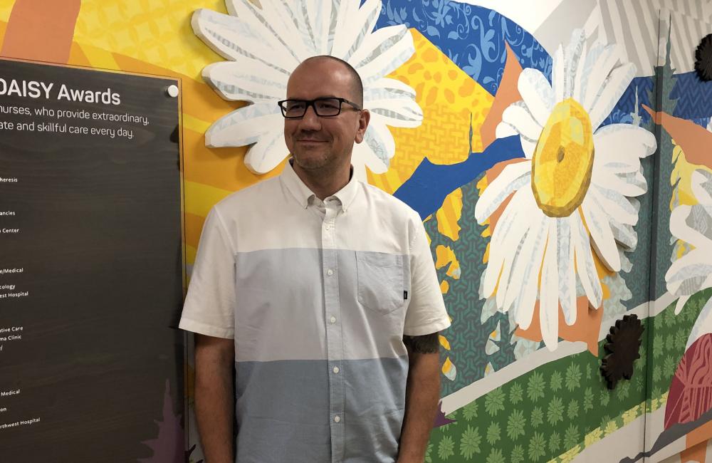 In a vibrant art display, colorful DAISY wall honors exemplary nursing
